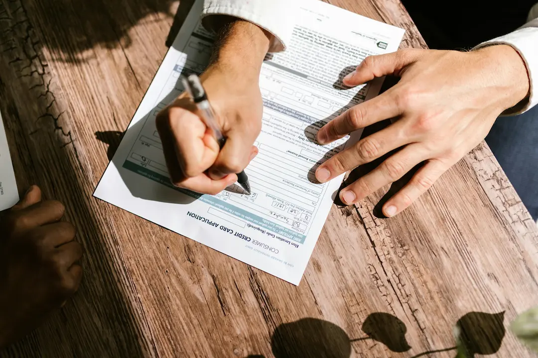Person filling out a credit line application — the tool that makes chunking possible